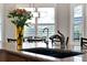Close up of a kitchen sink featuring flowers and a large window at 1382 Hayton Ave, Deland, FL 32724