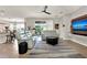 Open-concept living room featuring comfortable seating and access to the outdoor patio at 1382 Hayton Ave, Deland, FL 32724