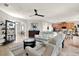 Spacious living area with sofas, an entertainment center, and views into the kitchen at 1382 Hayton Ave, Deland, FL 32724