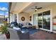 Inviting screened patio with a ceiling fan, comfortable seating, and decor for relaxing outdoor living at 1382 Hayton Ave, Deland, FL 32724