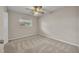Comfortable bedroom with carpet, ceiling fan, neutral walls, and a window at 1409 Overlake Ave, Orlando, FL 32806
