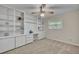 Bedroom featuring built in cabinets and desk, ceiling fan, neutral walls, and carpet at 1409 Overlake Ave, Orlando, FL 32806