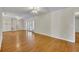Spacious living room features hardwood floors, sliding glass doors, and neutral wall color at 1409 Overlake Ave, Orlando, FL 32806