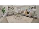 Staged living room featuring plush seating, a stylish glass coffee table, and neutral décor at 1409 Overlake Ave, Orlando, FL 32806