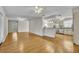 Spacious living area that flows seamlessly into the kitchen area with a breakfast bar, and modern stainless steel appliances at 1409 Overlake Ave, Orlando, FL 32806