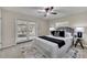 Bedroom with ceiling fan, and glass doors to the outside with a queen bed and bedside tables at 1409 Overlake Ave, Orlando, FL 32806