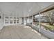 The enclosed patio has tile flooring and access to the backyard at 1409 Overlake Ave, Orlando, FL 32806