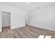 Neutral bedroom with luxury vinyl flooring and a walk-in closet for ample storage at 142 Guava Pass, Ocklawaha, FL 32179