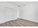 Bedroom with luxury vinyl flooring and a double door closet to maximize space at 142 Guava Pass, Ocklawaha, FL 32179