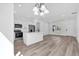 Modern kitchen with stainless steel appliances, an island, and white cabinetry at 142 Guava Pass, Ocklawaha, FL 32179