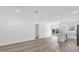 Bright and airy open floor plan with modern floors and stainless steel appliances at 142 Guava Pass, Ocklawaha, FL 32179