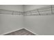Walk-in closet with neutral carpeting and metal shelving at 18058 Cider Mill Ln, Winter Garden, FL 34787