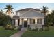 Charming two-story home featuring a welcoming front porch, well-manicured lawn, and tropical landscaping with palm trees at 18058 Cider Mill Ln, Winter Garden, FL 34787