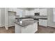 Bright kitchen featuring granite countertops, stainless steel appliances, and white cabinetry with ample storage space at 18058 Cider Mill Ln, Winter Garden, FL 34787