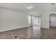 Bright living room with sliding glass door, neutral paint, and wood-look tile flooring at 18058 Cider Mill Ln, Winter Garden, FL 34787