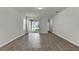 Bright living room with tile flooring, sliding glass doors leading to an outdoor space, and neutral wall colors at 18058 Cider Mill Ln, Winter Garden, FL 34787