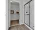 Modern bathroom featuring glass-enclosed shower and a walk-in closet for functional elegance at 18076 Cider Mill Ln, Winter Garden, FL 34787