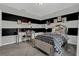 Chic bedroom featuring bold black and white decor, a stylish desk area, and plenty of natural light at 18076 Cider Mill Ln, Winter Garden, FL 34787