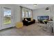 Inviting loft area with a sofa, desk, and balcony access, perfect for a home office or entertainment space at 18076 Cider Mill Ln, Winter Garden, FL 34787