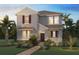 Charming two-story home boasts lush landscaping, a brick walkway, and a welcoming front porch with dark shutters at 18076 Cider Mill Ln, Winter Garden, FL 34787