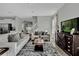 Comfortable living room featuring neutral colors, stylish furnishings, and a staircase in the background at 18076 Cider Mill Ln, Winter Garden, FL 34787