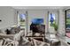 Inviting living room with ample natural light, stylish decor, and sliding glass door to the outside at 18076 Cider Mill Ln, Winter Garden, FL 34787