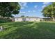 Spacious backyard with grass and tree at 1905 Diamond Dr, Orlando, FL 32807