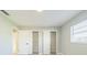 Bedroom with large closet and one window at 1905 Diamond Dr, Orlando, FL 32807