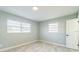 Cozy bedroom with tile flooring, two windows and fresh paint at 1905 Diamond Dr, Orlando, FL 32807