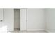 A bedroom with tiled floors and white closet at 1905 Diamond Dr, Orlando, FL 32807