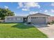 Charming single story home with brick exterior and well-maintained front yard at 1905 Diamond Dr, Orlando, FL 32807