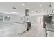 Modern kitchen featuring stainless steel appliances, an island cooktop, and lots of natural light at 1905 Diamond Dr, Orlando, FL 32807