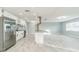 Bright, open kitchen featuring stainless steel appliances, granite countertops, and tile flooring at 1905 Diamond Dr, Orlando, FL 32807
