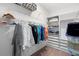 Organized walk-in closet featuring hanging racks, shelving, and drawers to maximize storage at 2017 Flora Pass Pl, Kissimmee, FL 34747