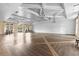 Large event space featuring ample room for gathering, light hardwood floors and elegant lighting fixtures at 2017 Flora Pass Pl, Kissimmee, FL 34747