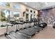 Bright fitness center equipped with state-of-the-art treadmills and exercise machines at 2017 Flora Pass Pl, Kissimmee, FL 34747