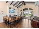 Stylish bar area featuring counter seating, decorative tile, and ample lighting for entertaining in a community space at 2017 Flora Pass Pl, Kissimmee, FL 34747