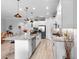 Well-lit kitchen with stainless appliances, large island with granite countertops, and ample cabinet space at 2017 Flora Pass Pl, Kissimmee, FL 34747
