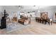 Bright and airy living room with wood floors, recessed lighting, neutral tones, and an open layout at 2017 Flora Pass Pl, Kissimmee, FL 34747