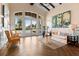 A comfortable lobby area with a sofa, chairs, and large windows providing natural light and inviting atmosphere at 2017 Flora Pass Pl, Kissimmee, FL 34747