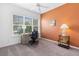 Comfortable home office with ample natural light, desk, and tasteful decor at 2017 Flora Pass Pl, Kissimmee, FL 34747