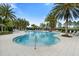 Inviting outdoor pool with a sun shelf, lounge chairs and covered seating at 2017 Flora Pass Pl, Kissimmee, FL 34747