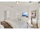 Spacious primary bedroom with a view into the en suite bath and sitting room at 2320 Treasure Hill St, Clermont, FL 34715