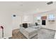 Bright upstairs living space with a sectional couch, providing ample room to relax at 2320 Treasure Hill St, Clermont, FL 34715