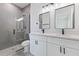 Modern bathroom featuring double vanity, sleek fixtures, and a glass-enclosed shower at 2436 Sw 155Th Ln, Ocala, FL 34473