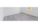 Bright, empty bedroom featuring contemporary gray flooring and a single window at 2436 Sw 155Th Ln, Ocala, FL 34473