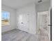 Spacious bedroom with contemporary gray flooring and a closet in view at 2436 Sw 155Th Ln, Ocala, FL 34473