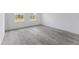 Bright bedroom with neutral color scheme and wood-look flooring at 2436 Sw 155Th Ln, Ocala, FL 34473