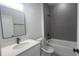 Modern bathroom featuring a white vanity with a sleek mirror and modern fixtures at 245 Marion Oaks Golf Rd, Ocala, FL 34473