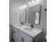 Contemporary bathroom showcasing dual sinks with quartz counters and black fixtures at 245 Marion Oaks Golf Rd, Ocala, FL 34473